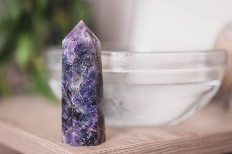Amethyst crystal point with beads of water condensed